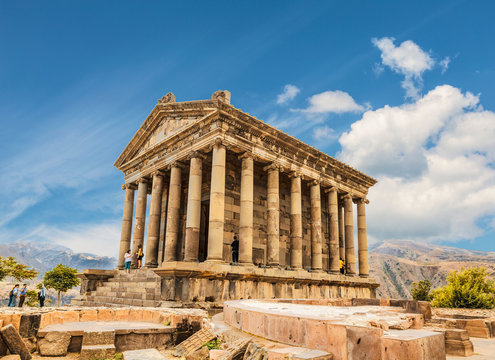 tourists near the temple of garni - a pagan temple in armenia was built in the first century ad by t