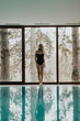 © BGStock72 - Pretty woman standing by the pool in the spa