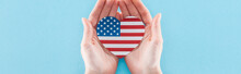 Partial View Of Woman Holding Heart Made Of  National American Flag On Blue Background, Panoramic Shot