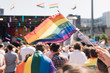 © HEX./Stocksy - People With Rainbow Flags Attending a Gay pride