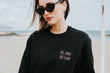 © Susana Ram?rez/Stocksy - Portrait of woman with sweatshirt with message