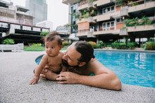 Father And Baby Poolside