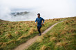 © Thomas Pickard Photography Ltd/Stocksy - Fit athletic man running along a dirt path.
