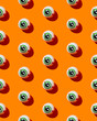 © Kaat Zoetekouw/Stocksy - Halloween eye candy on orange background