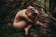 © Leah Flores/Stocksy - Naked woman sitting outdoors