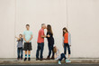 © Erin Drago Photography/Stocksy - Mom and Dad kissing with Kids Around