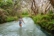 © Gillian Vann/Stocksy - girl walking in a freshwater stream