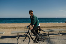 Young Man Riding A Bike