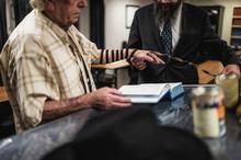 A Jewish Rabbi And A Man In A Synagogue