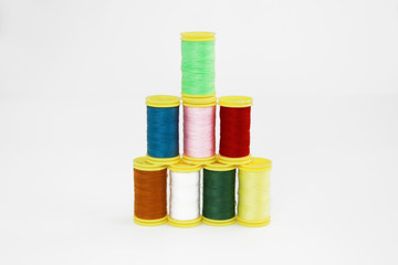 colorful threads for sewing or embroidery on a white background