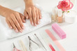 © New Africa - Woman waiting for manicure and tools on table, closeup. Spa treatment