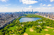 Aerial view of the Central park in New York with golf fields and tall skyscrapers surrounding the park.