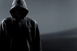 © BillionPhotos.com - Thief in black clothes on grey background