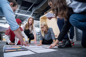 blonde businesswoman having meeting with multiethnic startup business team