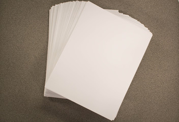 Top of stacked fanned out blank paper