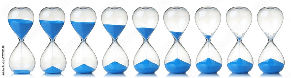 Collection of hourglasses with blue sand showing the passage of time - obrazy, fototapety, plakaty 