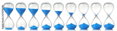 Fotomural Collection of hourglasses with blue sand showing the passage of time