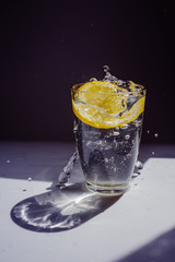 glass of water with ice and lemon