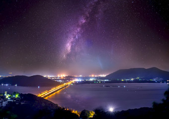 Wall Mural - milky way galaxy on songkhla lake thailand. long exposure photograph, with grain.image contain certa
