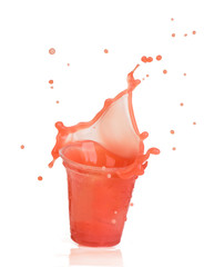 Wall Mural - splash of strawberry juice in a plastic cup