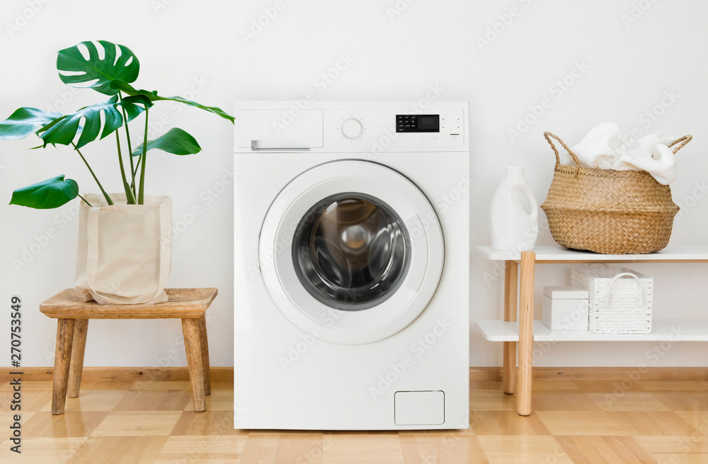 Clothes washing machine in laundry room interior - obrazy, fototapety, plakaty 