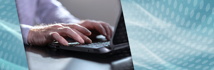 Hands of businessman using laptop, close up; panoramic banner