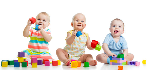 nursery babies playing with toys isolated on white background