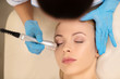 © zinkevych - Top view of dermatologist doing under eye skin treatment