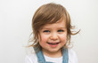 © rigg - Happy beautiful Caucasian toddler with blue eyes smiling laughing portrait on neutral background