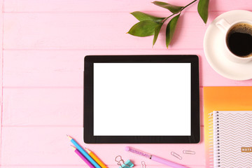Modern digital tablet and school stationery on a colored background top view. Kontpt back to school. Place for text.