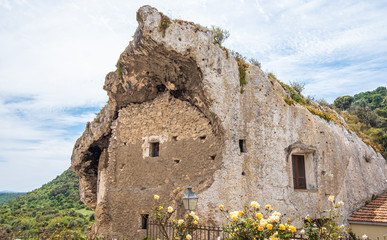 Poster - Domus de Janas Sa Rocca in the village of Sedini, province of Sassari , Sardinia, Italy.  Prehistorical chamber tombs