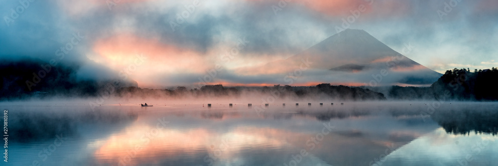Beautiful mystical sunrise at Lake Shōji with Mount Fuji as a backdrop and a row boat in the foreground - obrazy, fototapety, plakaty 