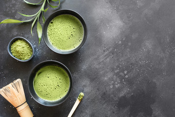 Still life with Japanese matcha green tea on black table. Top view. Space for text.