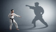 © ra2 studio - Young karate man confronting with his own shadow