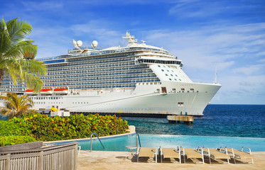 Wall Mural - View from pool at tropical resort on cruise ship docked at port 