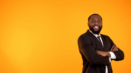 Wall Mural - Happy handsome black man in business suit looking to camera and smiling template