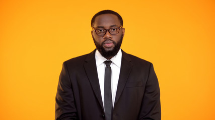 Wall Mural - Determined african-american male in suit looking to camera, department leader