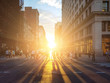 © deberarr - View of a busy intersection in Manhattan with sunlight shining on crowds of people in New York City