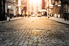 New York City - Cobblestone Street View In Soho With Sunlight Background In Black And White