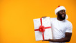 © motortion - Santa man holding gift box, holidays discounts, time to buy presents, template