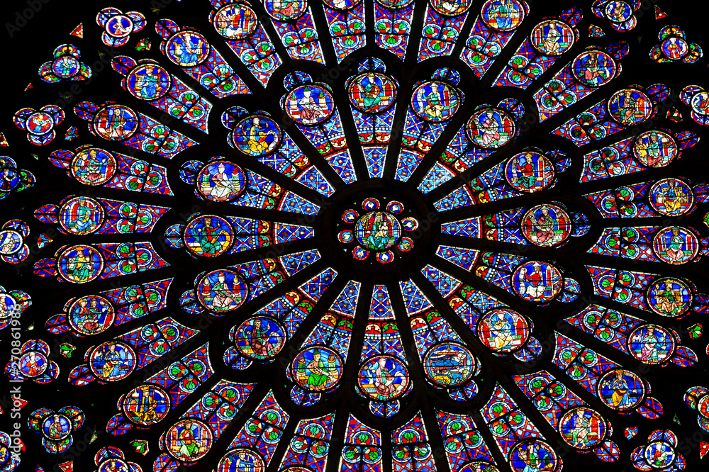 PARIS – FRANCE: The North Rose window at Notre Dame cathedral dates from 1250 and is also 12.9 meters in diameter. Its main theme is the Old Testament. - obrazy, fototapety, plakaty 