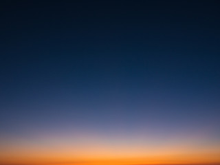beautiful gradient sky at dusk, from dark blue to orange