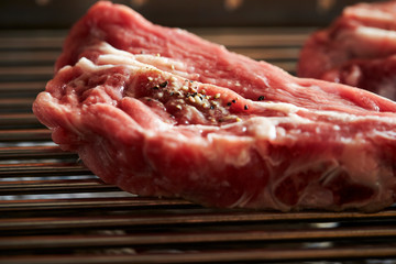 Canvas Print - Fresh raw meat with seasoning on grill