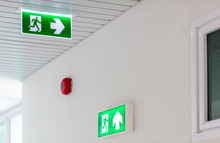 Green Emergency Exit Sign Showing The Way To Escape.Fire Exit In The Building.