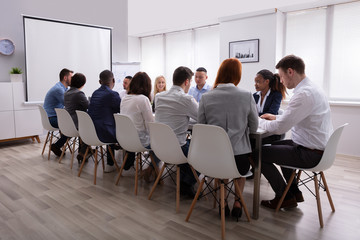 Wall Mural - Group Of Business People Sitting Together In The Meeting