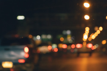 Abstract blurry traffic road bokeh light view from inside a car.