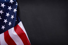 American Flag On Black Background With Copy Space.