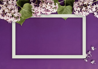 Creative layout made with  flowers on bright purple background