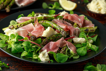 Grilled Asparagus, parma ham salad with mozzarella cheese and green vegetables