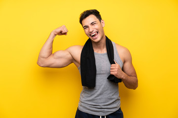 Handsome sport man over isolated background making strong gesture